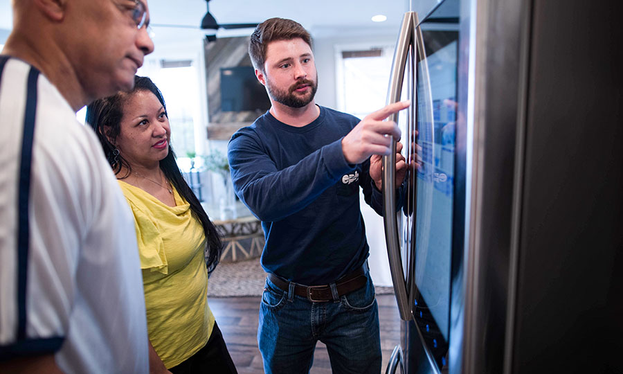 EPB employee helping couple with smart fridge