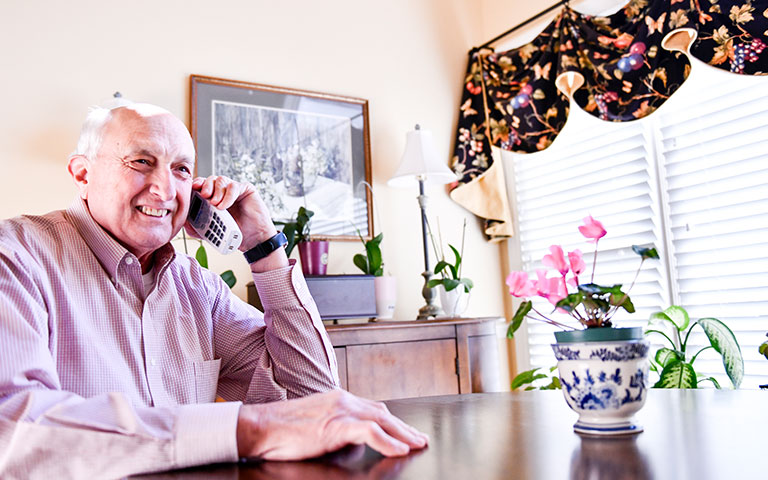 Senior citizen EPB customer being helped by customer services via telephone
