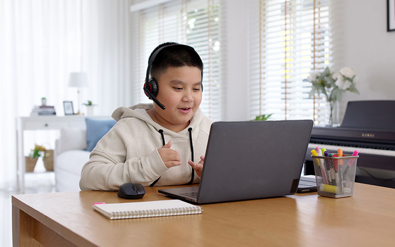 Young student using laptop