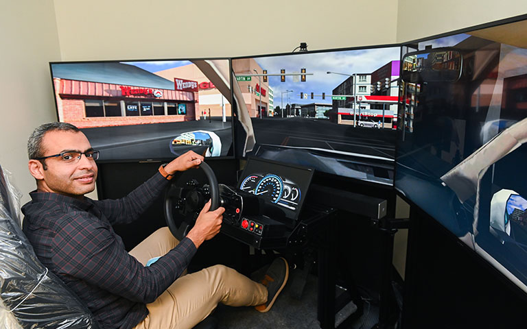 Man using a high-end driving simulator