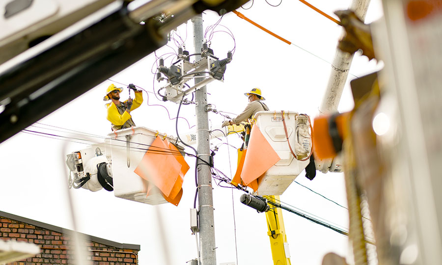 EPB Linemen working on power poles