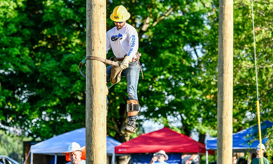 EPB Lineman climbing down a pole at the Lineman Rodeo Event