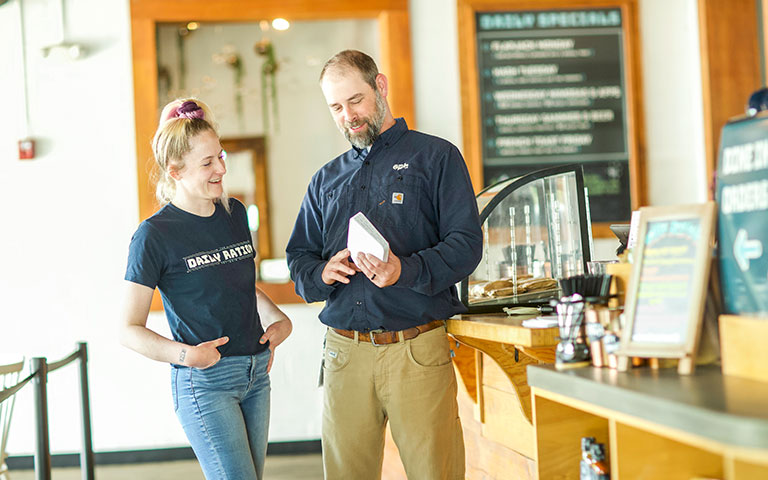 EPB Employee helping a restaurant employee with a router