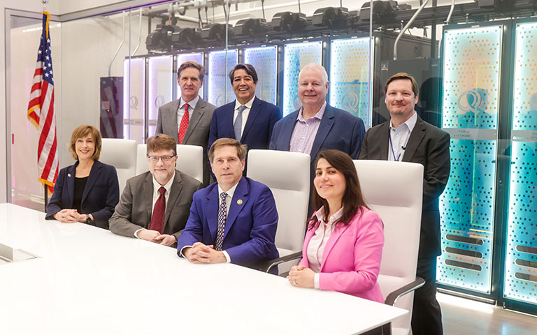 group of government and EPB Executives posed in front of servers