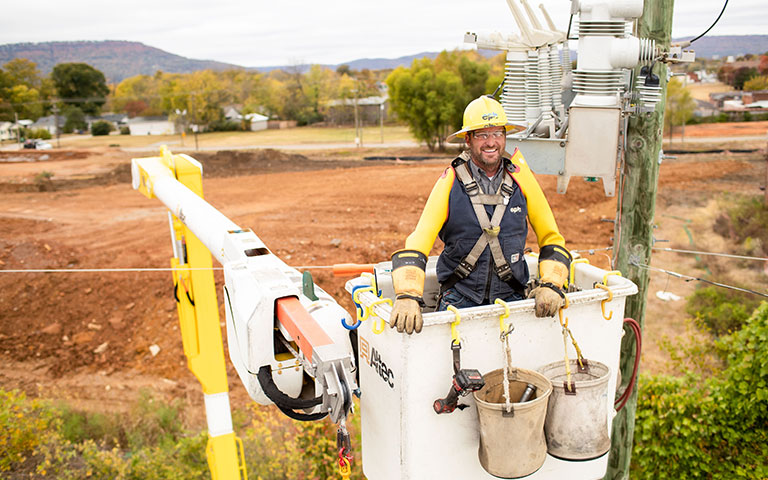 EPB Lineman working on power lines in a bucket truck